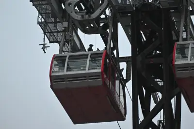 Masked daredevil who climbed atop Roosevelt Island tram is charged in reckless stunt