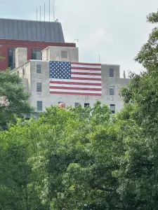 The message behind an American flag flying across from the White House