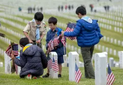 Photos: Scouts and volunteers place over 100,000 flags for Memorial Day