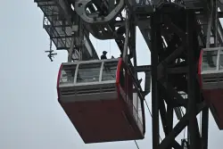 Masked daredevil who climbed atop Roosevelt Island tram is charged in reckless stunt