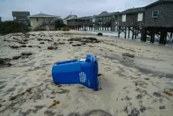 Dozens rescued as remnants of typhoon hits Alaska while nor’easter brings flooding to East Coast