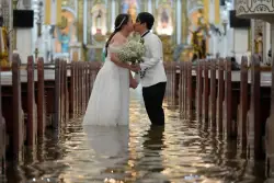 Photos: Filipino couple marry in typhoon-flooded church